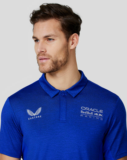 Close up of the blue polo showing Castore and Oracle Red Bull Racing logos on the chest