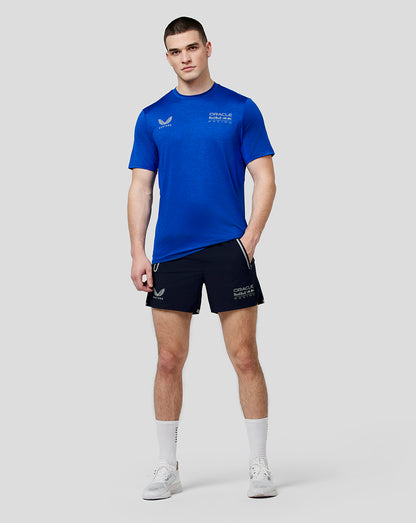 Male model wearing Oracle Red Bull Racing running shorts in Night Sky navy with zipped side pockets