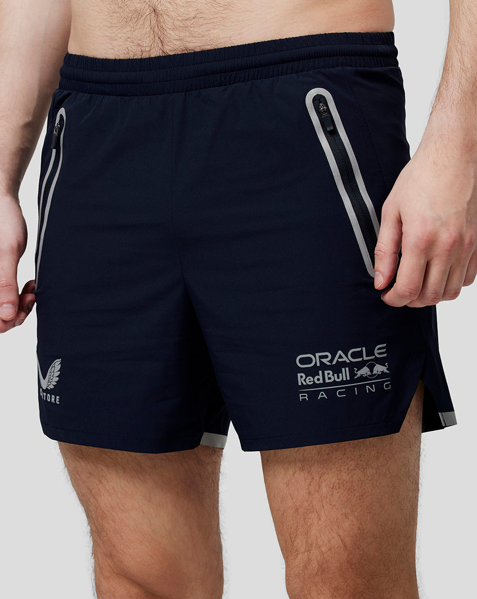 Close up of navy Oracle Red Bull Racing running shorts showing zipped side pocket and reflective trim