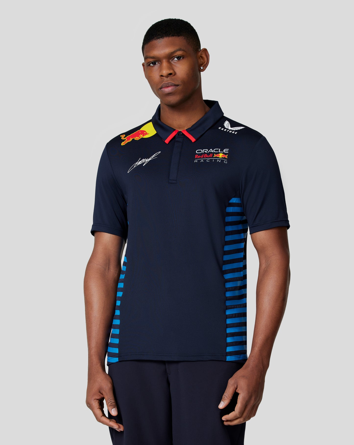 Male model in night sky Checo polo with blue side stripes and racing branding