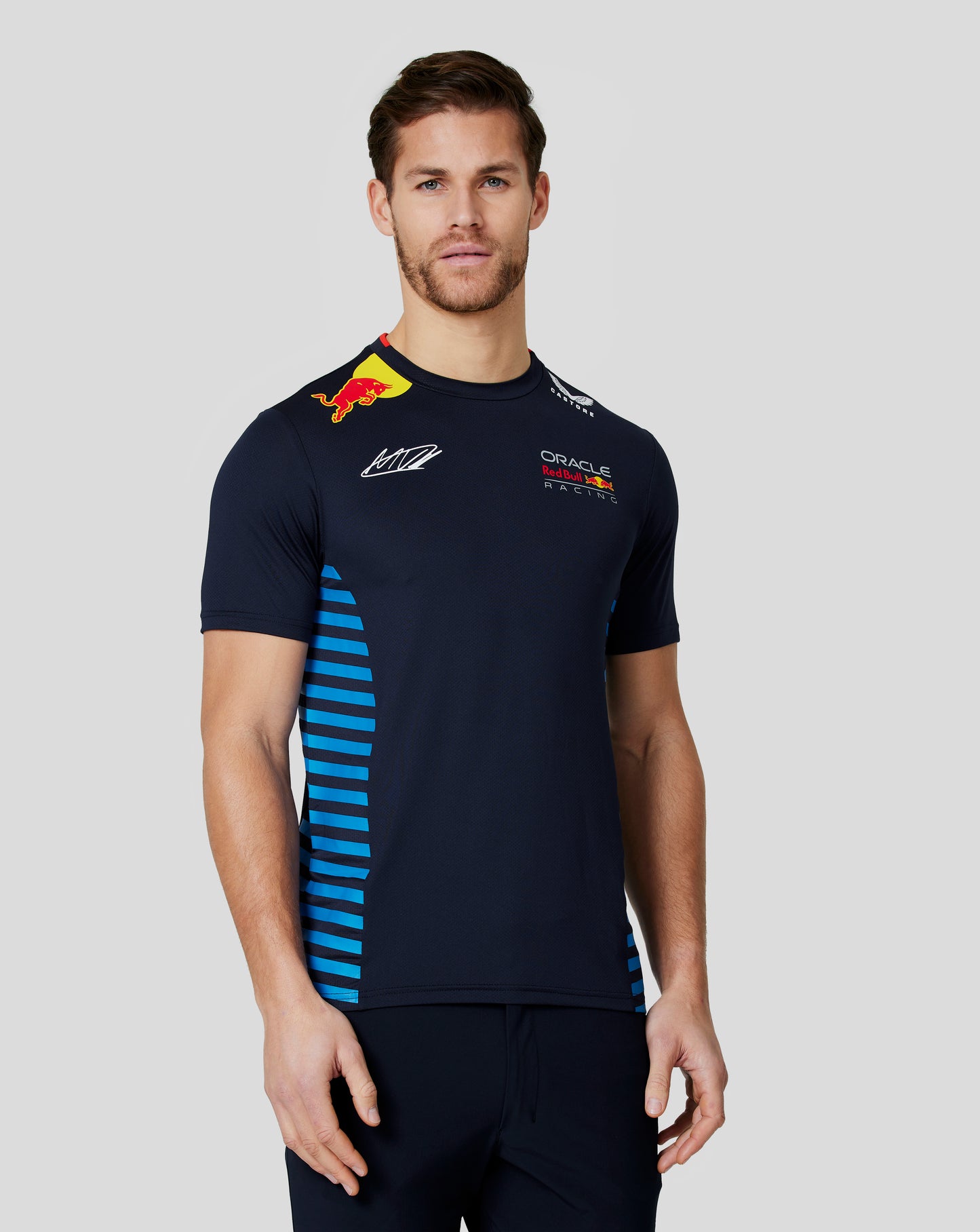 Back view of a man wearing a night sky Red Bull Racing Verstappen T shirt, shows large red 1 and Verstappen name across the back