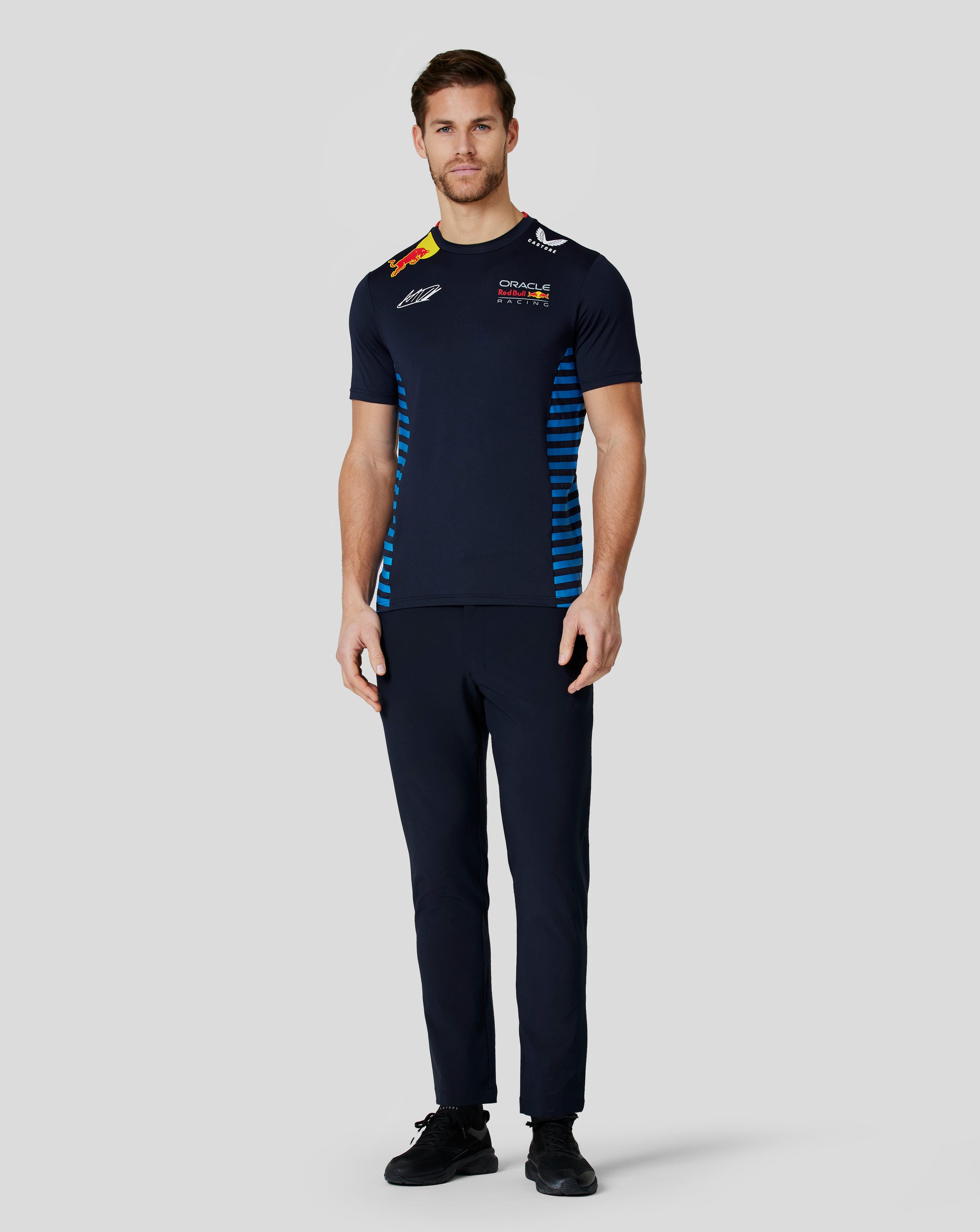 Model wearing night sky navy Oracle Red Bull Racing Teamline T shirt with team logos and blue side panels.