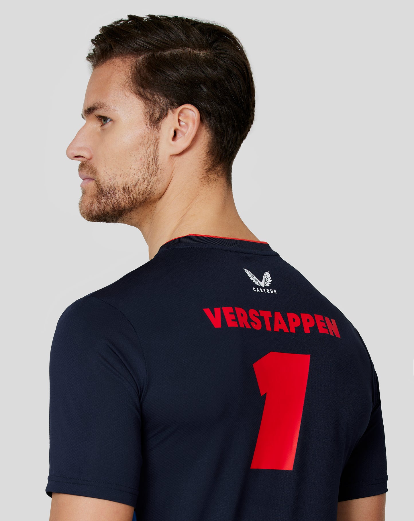Back view of navy Teamline T shirt with bold red Verstappen name and large number on the back.