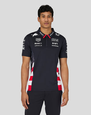 Front view of a man wearing a navy Night Sky Oracle Red Bull Racing Teamline polo with chest logos and a red collar.