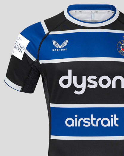 Front close-up of Bath Rugby Home Shirt with Castore logo on left chest, Bath Rugby crest on right, and dyson and airstrait across the chest.