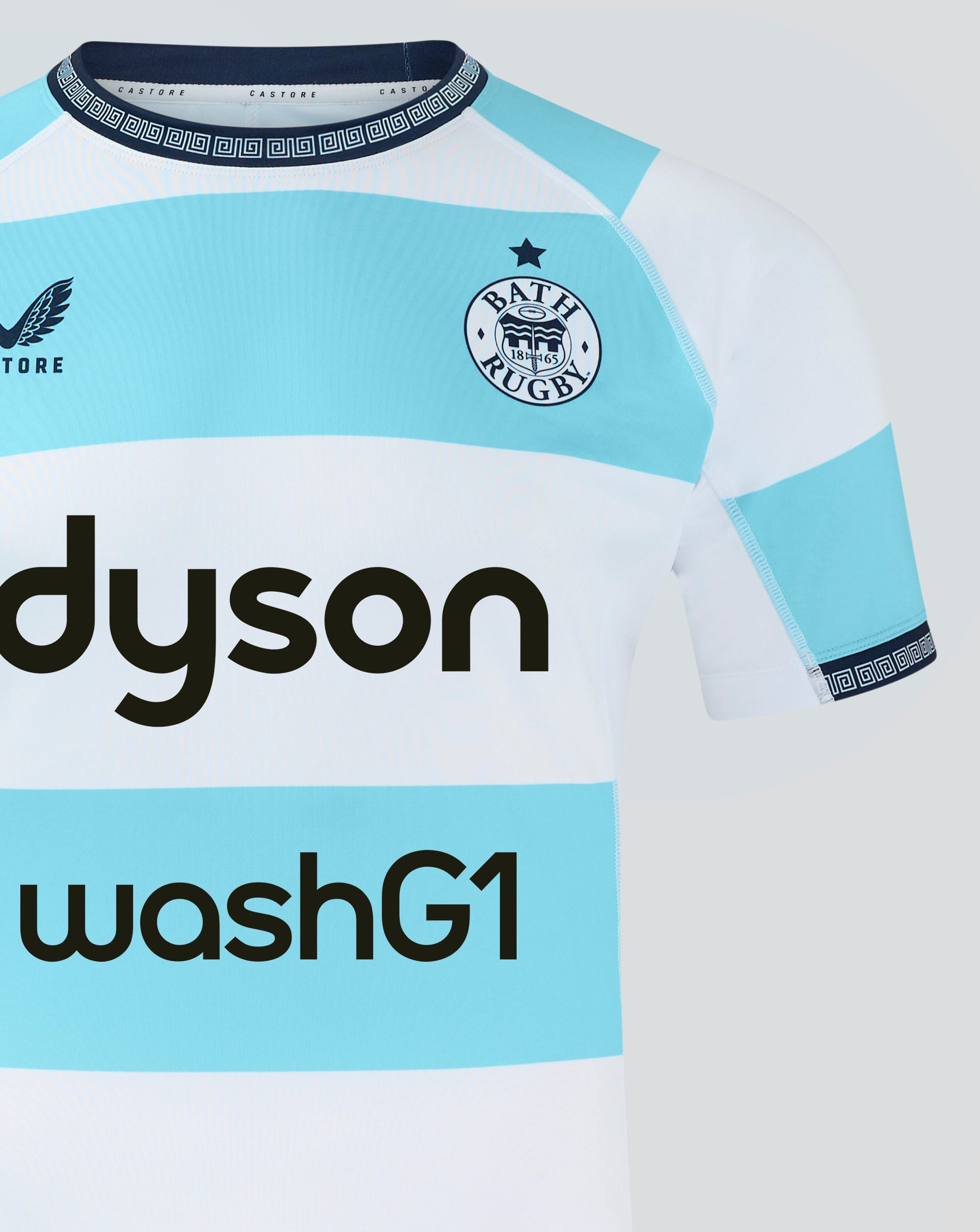 Close-up of Bath Rugby Euro Pro Shirt 24/25 front with blue chest panel Castore logo and Bath Rugby crest and Dyson washG1 text.