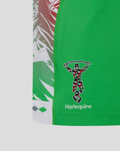 Close up of green Harlequins shorts showing the Harlequins crest near the hem and diagonal side panel pattern.