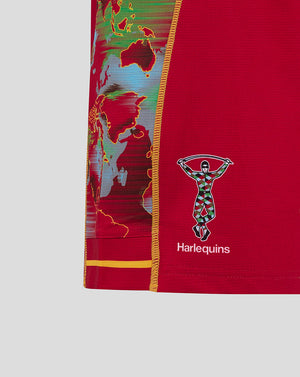 Left side view of red Harlequins shorts showing world map side panel and Harlequins crest