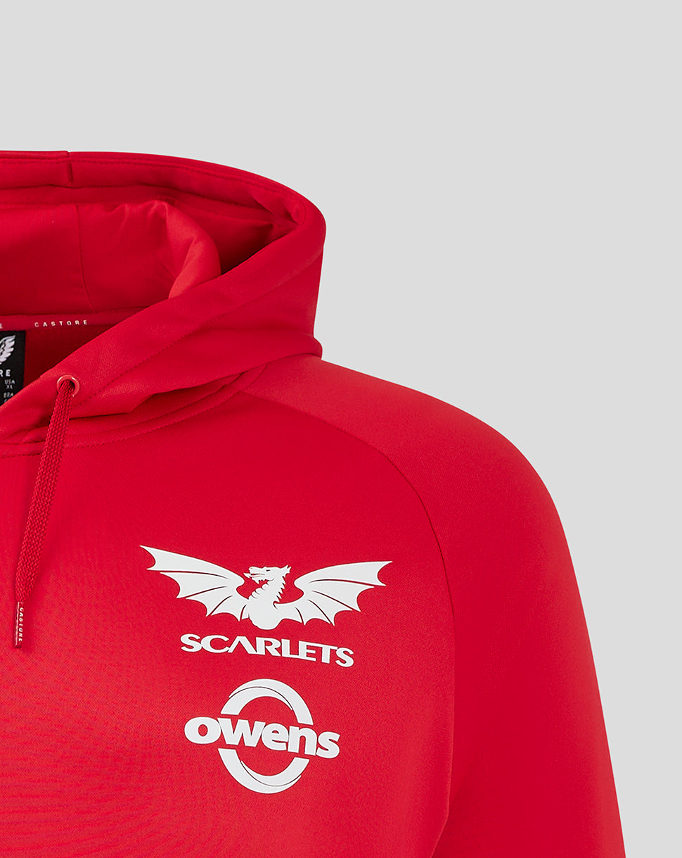Close-up of red Scarlets women hoody chest area showing Castore logo on left, Scarlets crest on right, and Owens logo.