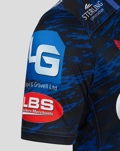 Sleeve close up of Scarlets away shirt featuring blue camouflage pattern and LBS Builders Merchants logo