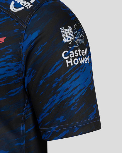 Close up of Scarlets away shirt sleeve in blue black camo with Castell Howell sponsor graphic.