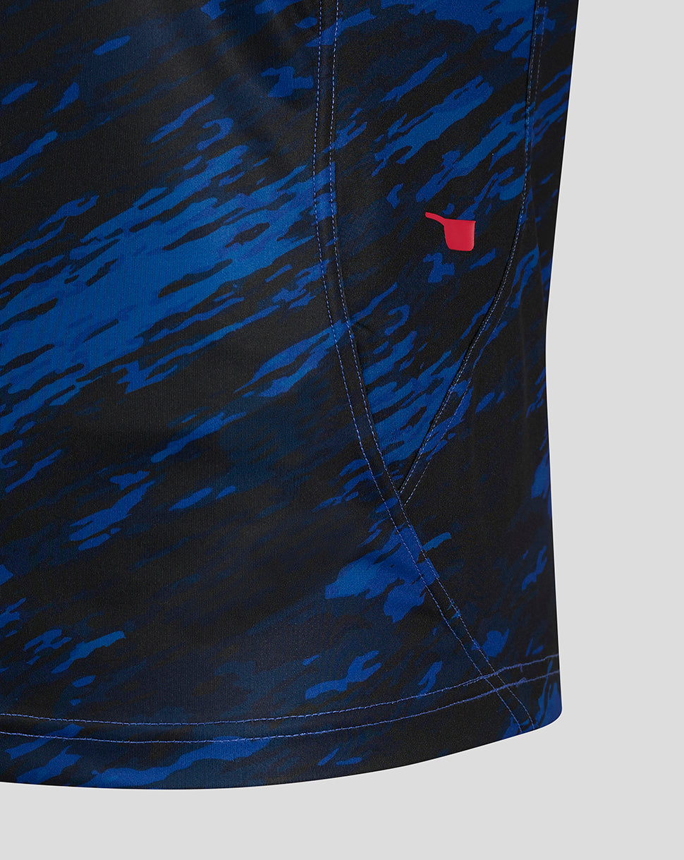 Close up of Scarlets away shirt sleeve showing blue camo pattern and small red sponsor emblem.