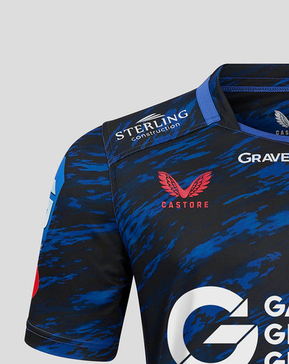Shoulder close up of Scarlets away shirt showing Sterling Construction patch and Castore branding on blue camouflage fabric