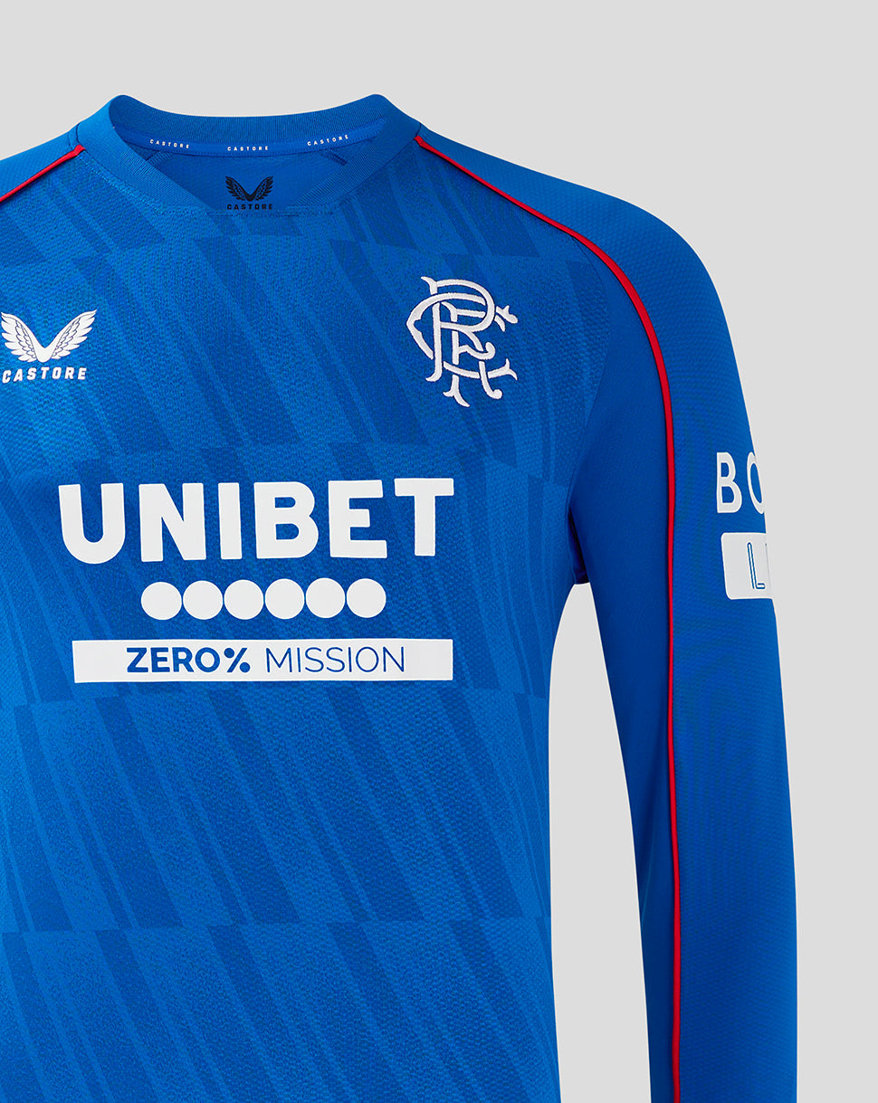 Close-up of blue Rangers home long sleeve shirt front showing crest on chest and UNIBET sponsor with red piping along shoulder seam