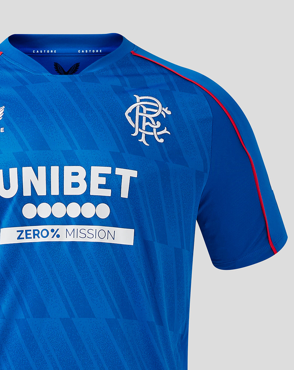 Rangers blue home shirt close up showing crest on chest and red piping along the seams