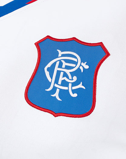 Rangers club crest patch on left chest of the white away shirt with a blue shield and red border