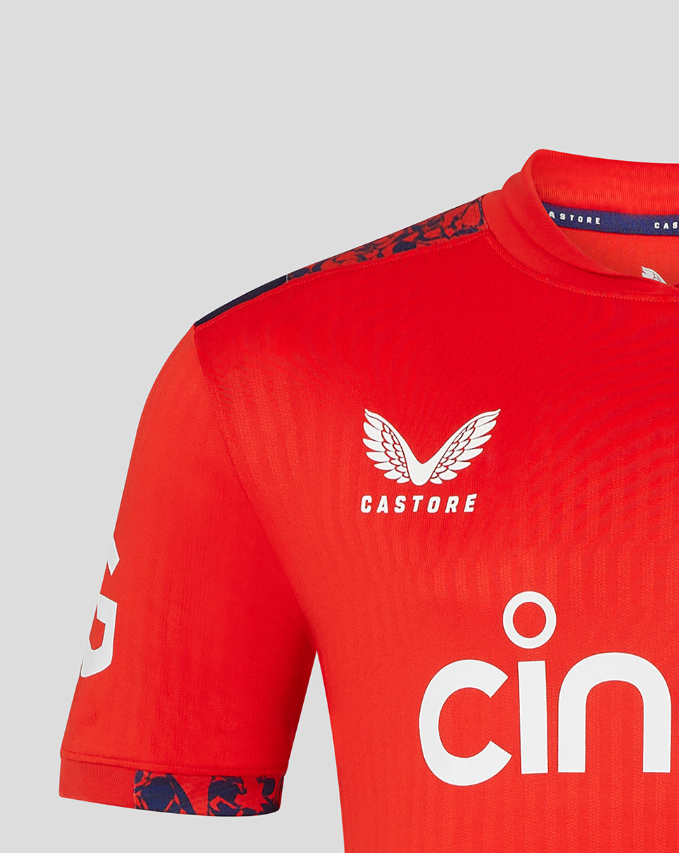 Front view of red England Pro T20 shirt with England crest on the left chest and bold sponsor print across the chest.