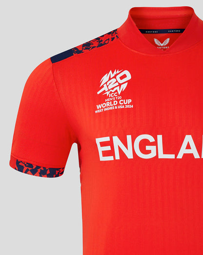 Front view of red England World Cup T20 shirt with ENGLAND across the chest, crest on the left chest, and patterned blue shoulders.