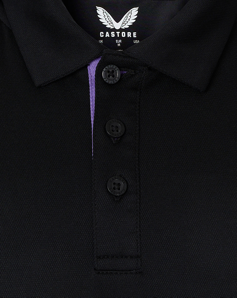 Close up of polo collar and concealed placket with purple inner trim and Castore branding