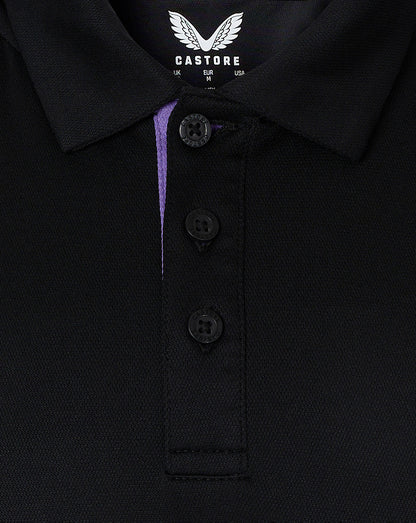 Close up of polo collar and concealed placket with purple inner trim and Castore branding