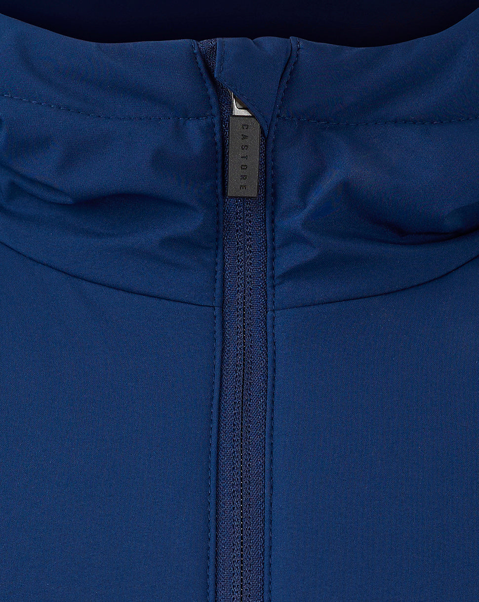 Close-up of navy jacket zipper with Castore branded pull.