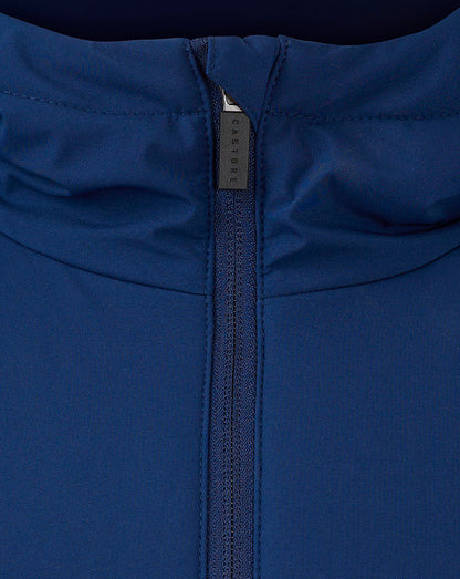 Close-up of navy jacket zipper with Castore branded pull.