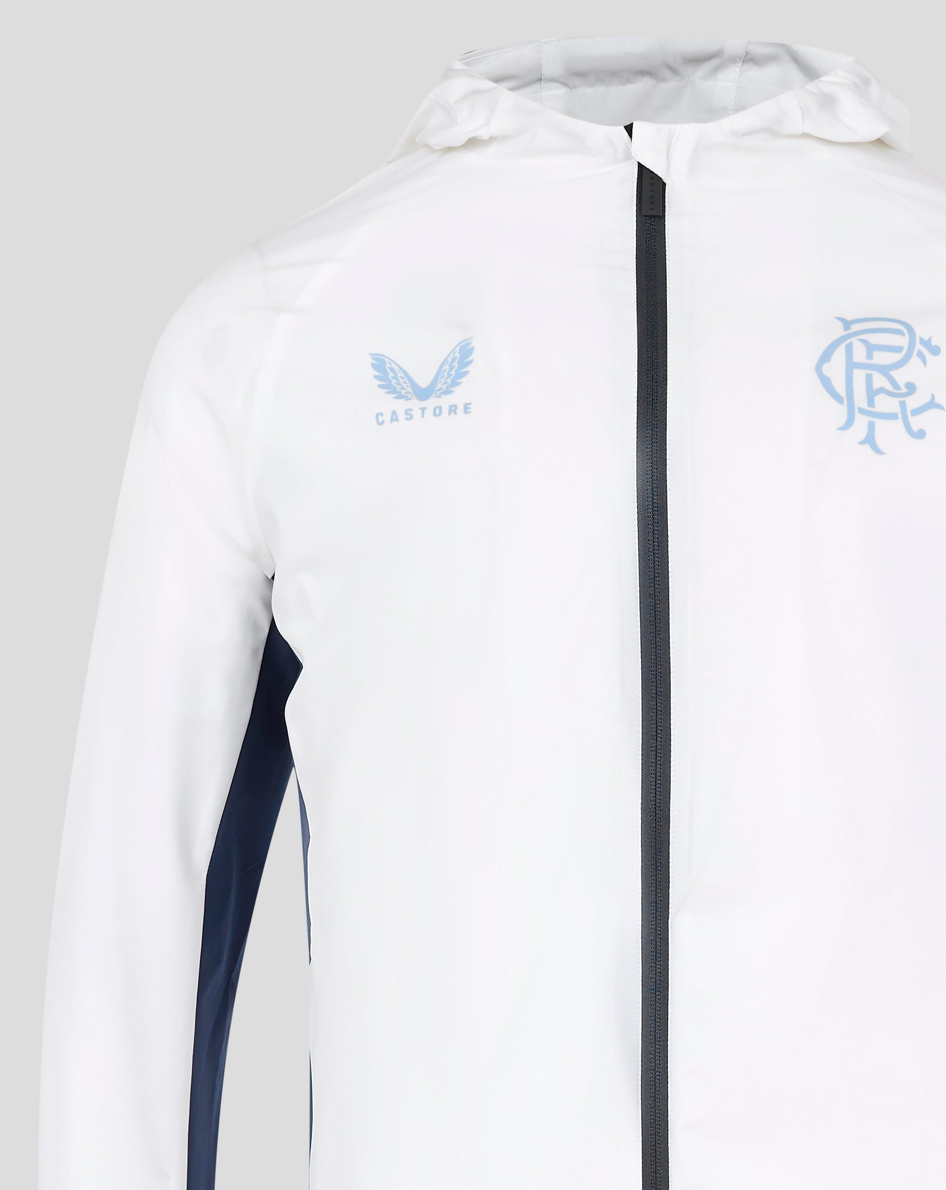 Close up of chest area on white Rangers 24/25 Men's Pro Players Training Rain Jacket with dark center zipper and blue logos left and right