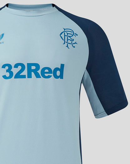 Rangers training shirt chest close up showing the club crest and 32Red sponsor on light blue fabric.