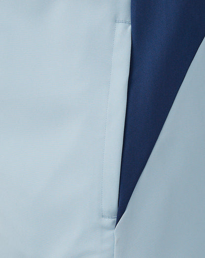 Close-up of a two-tone Rangers Pro Players jacket with a light blue front panel and navy side panel and sleeve.