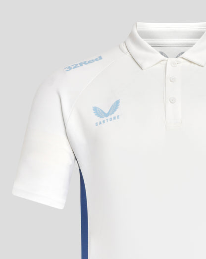 Close up of white Rangers polo with light blue 32Red shoulder logo and Castore wing crest on chest.