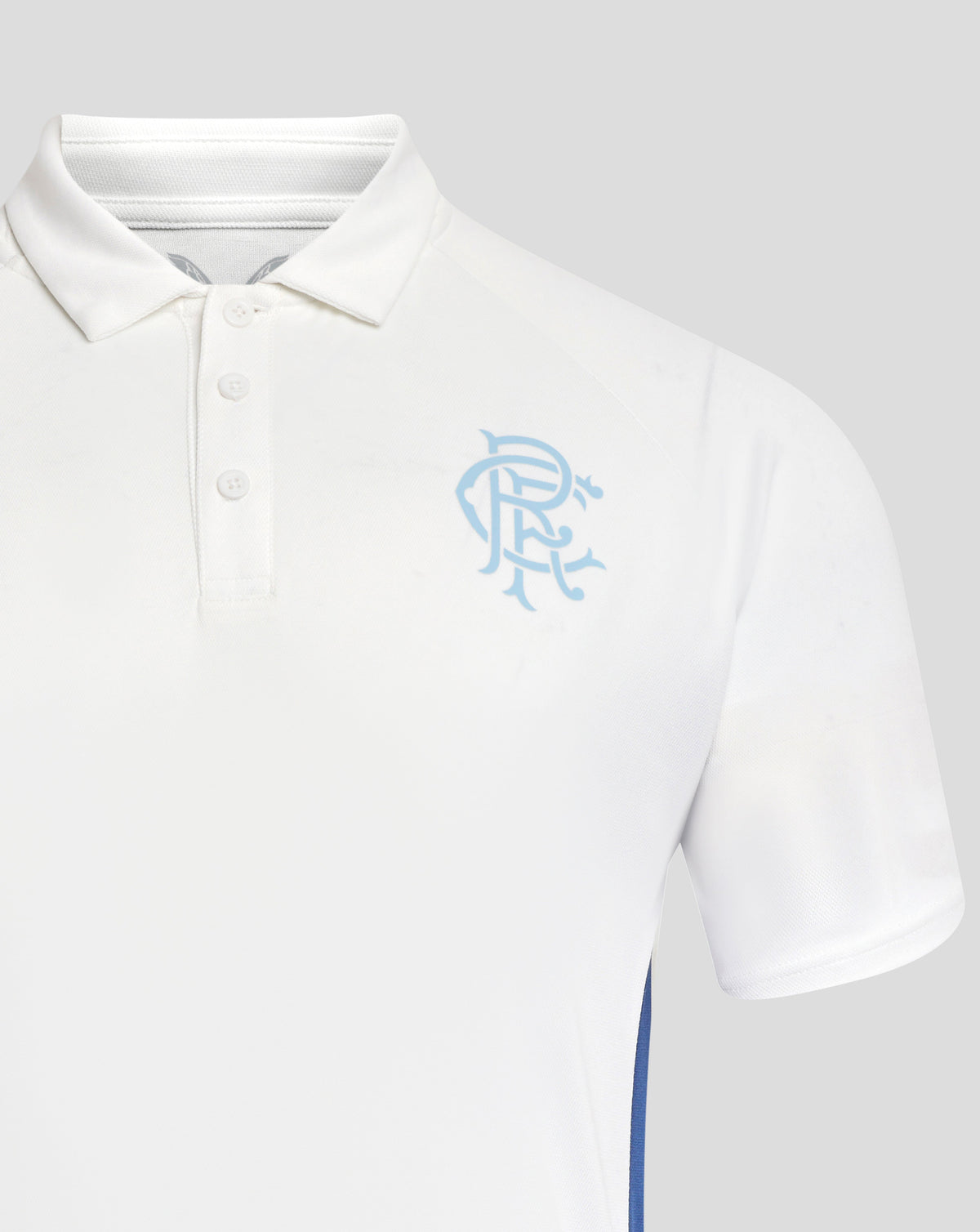 Close-up of white Rangers polo shirt showing collar buttons and a light blue crest on the left chest
