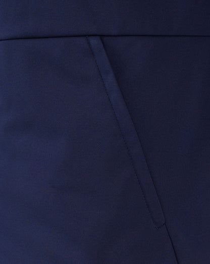 Close-up of navy softshell fabric and angled pocket seam on the Rangers travel jacket