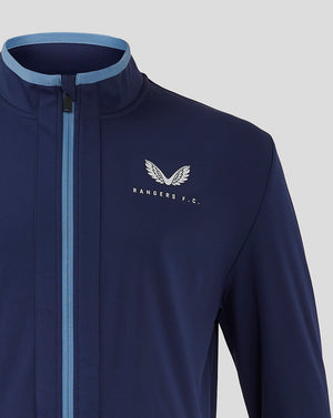 Detail of navy Rangers travel jacket with blue front zip and light blue collar trim, featuring left chest logo.