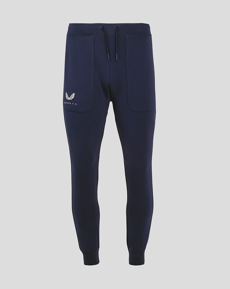 Front view of navy Rangers FC travel pant with external drawcords gusset and zipped side pockets, logo on right pocket and left calf