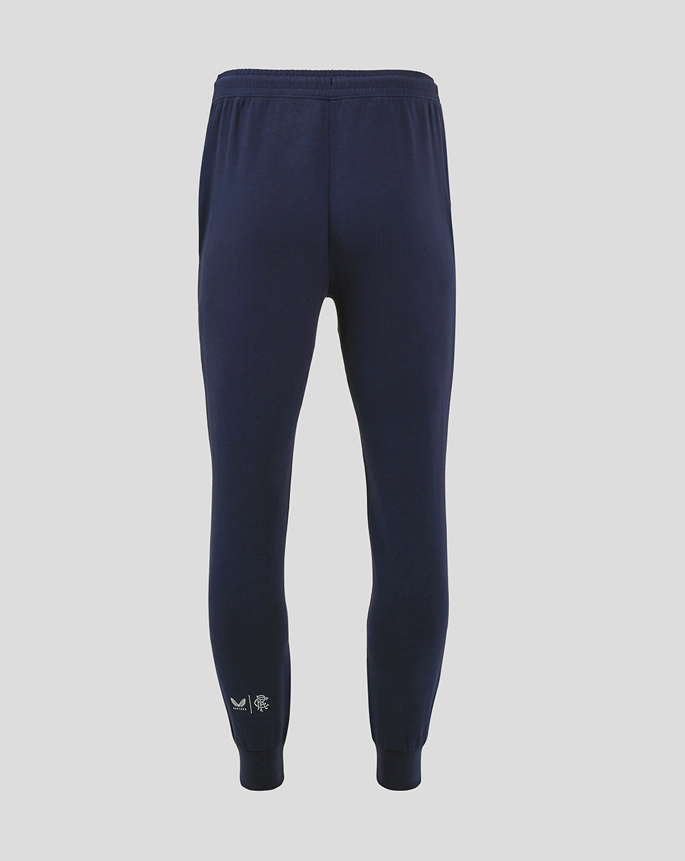 Back view of navy Rangers FC travel pant with ribbed cuffs and small branding at the ankle