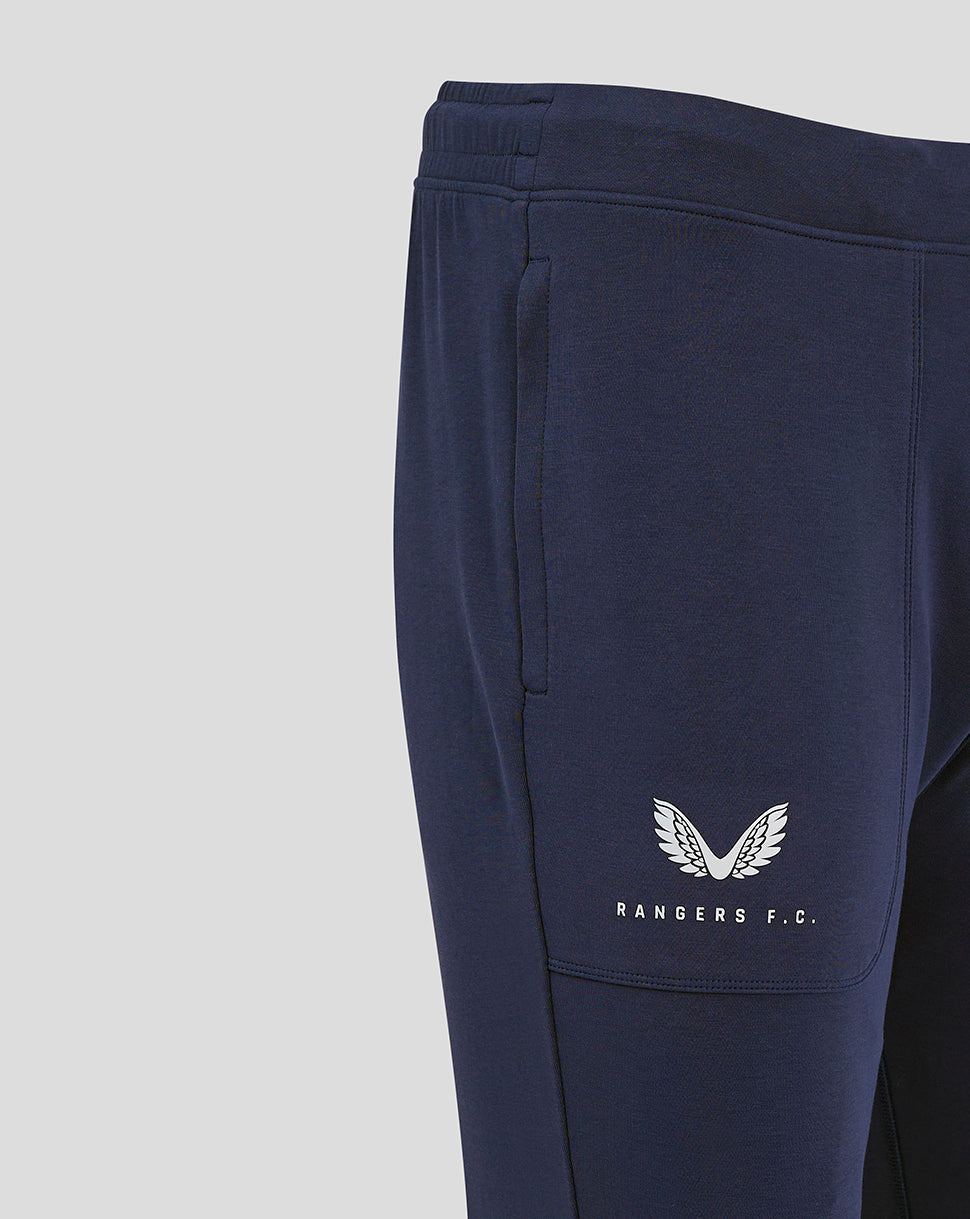 Close up of navy Rangers FC travel pant showing side pocket and white branding on the leg