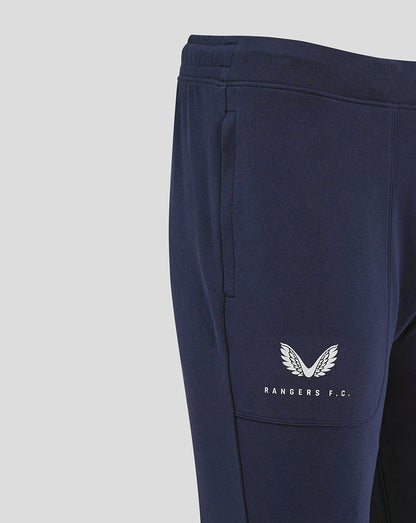 Close up of navy Rangers FC travel pant showing side pocket and white branding on the leg