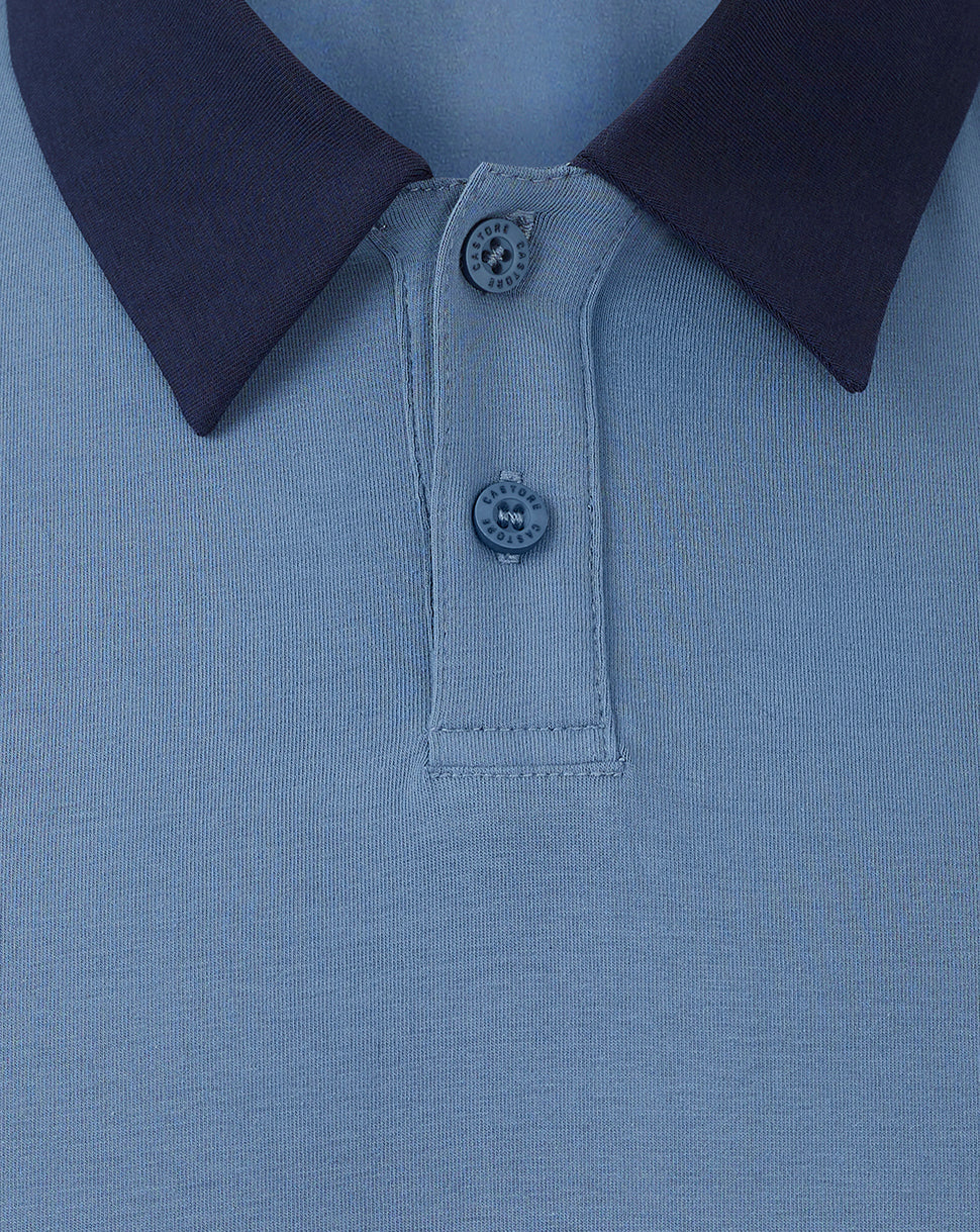 Close up of light blue Rangers travel polo showing a dark navy foldover collar and two button placket