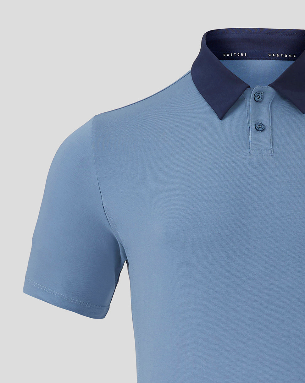 Front view of light blue Rangers travel polo with navy foldover collar and Castore branding along inner neck