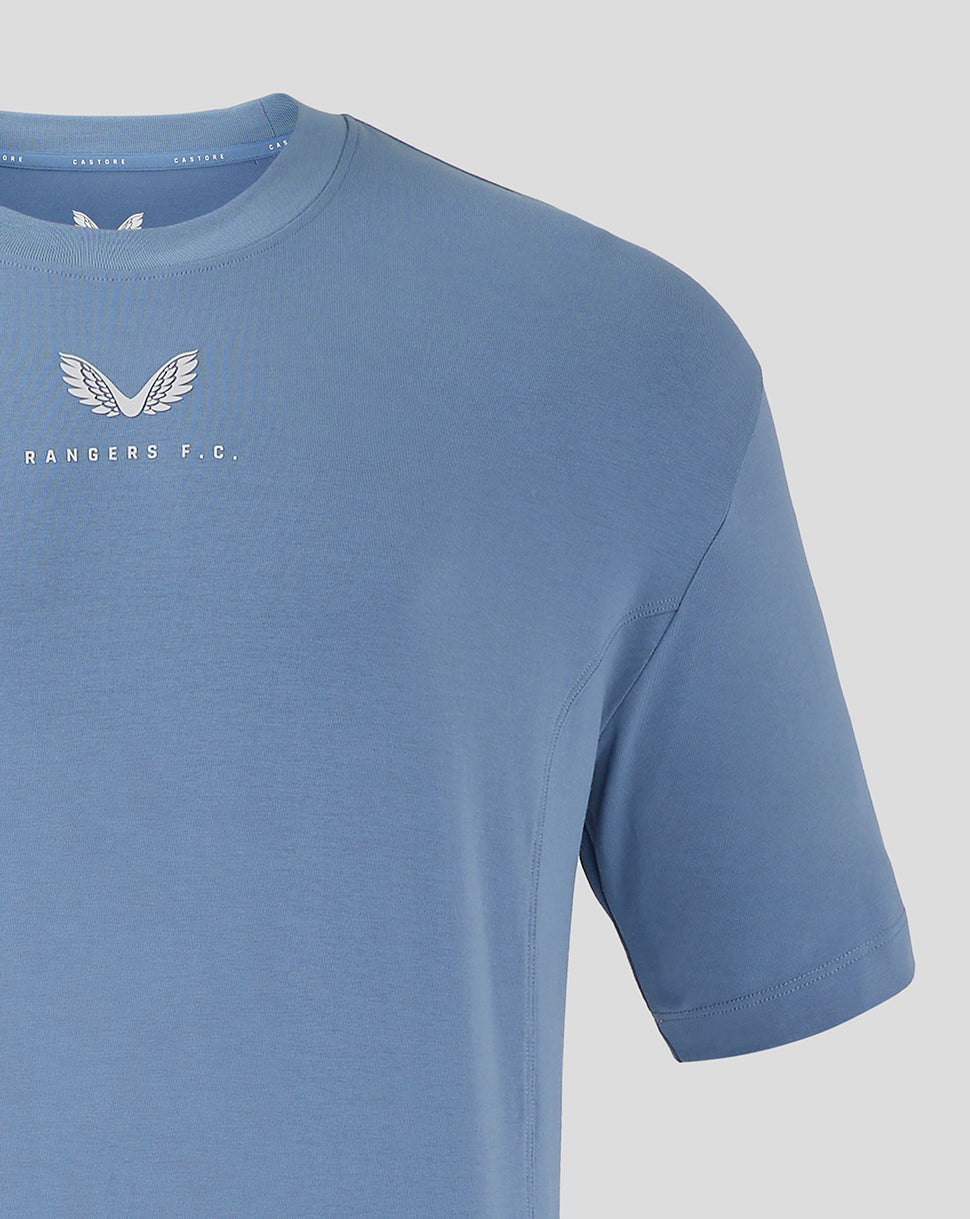 Front view of light blue Rangers FC travel shirt with small white crest on left chest