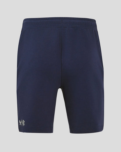 Back view of navy Rangers FC travel shorts with elastic waistband and small white club logo near the hem.