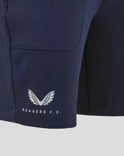 Close-up of navy shorts hem featuring Rangers FC crest and Castore branding at the bottom.