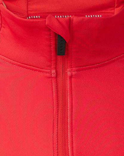 Close up of the red quarter zip neckline with visible zipper and Castore branding on the inside collar