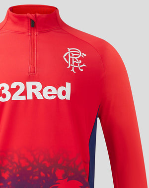 Close-up of upper chest with Rangers crest and 32Red logo on red quarter zip training top