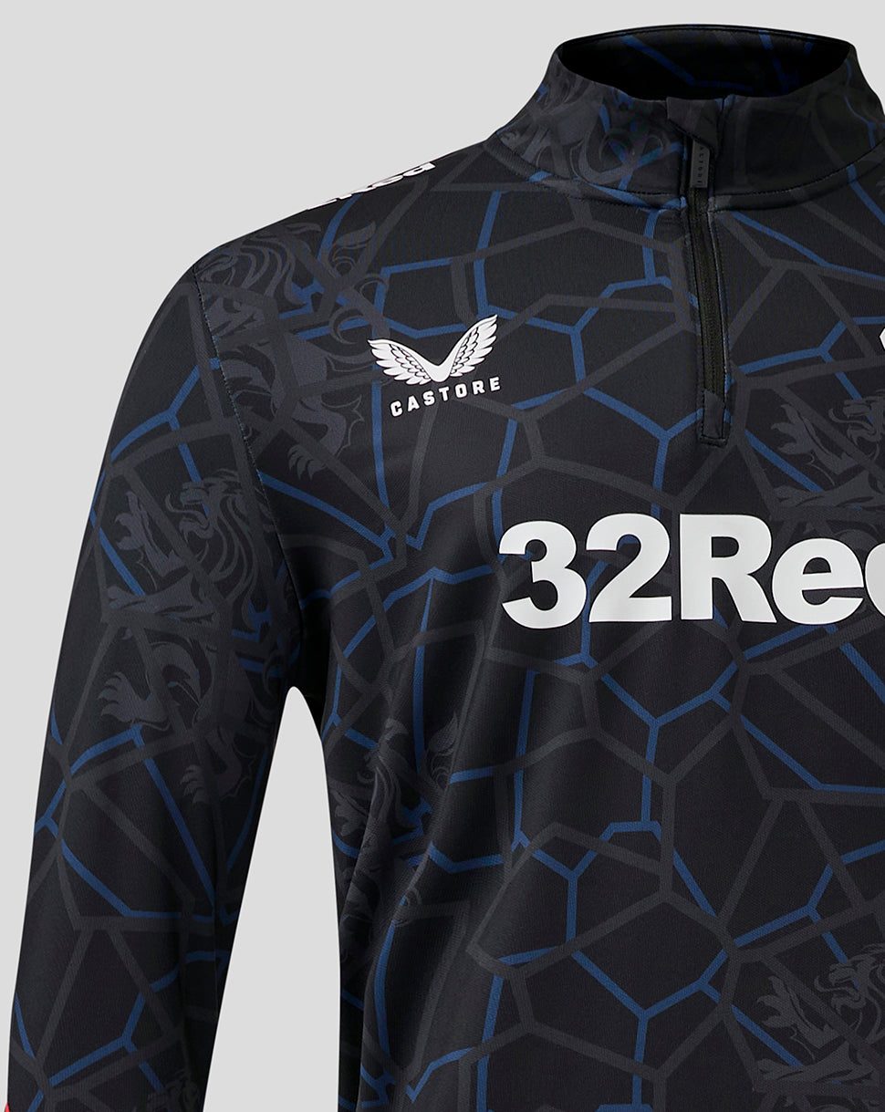 Front view of Rangers Third Matchday quarter zip midlayer with dark geometric pattern, large 32Red sponsor across chest, left chest Rangers crest and Castore branding on right