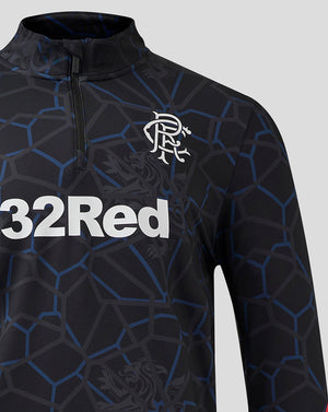 Close up of Rangers Third Matchday 1/4 Zip Midlayer showing zip collar and crest on chest against the geometric pattern