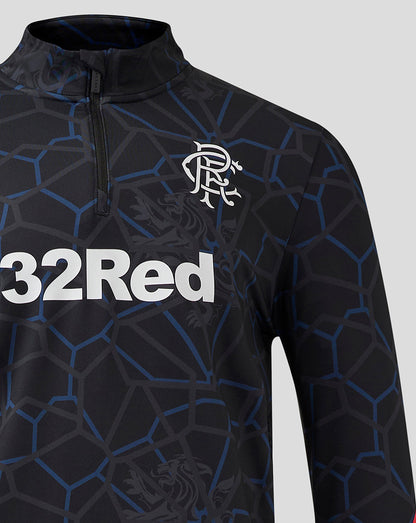 Close up of Rangers Third Matchday 1/4 Zip Midlayer showing zip collar and crest on chest against the geometric pattern