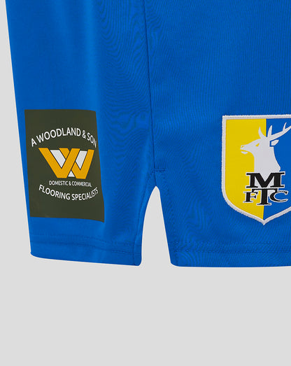 Blue Mansfield Home Shorts showing A Woodland & Son patch on left leg and crest shield on right leg