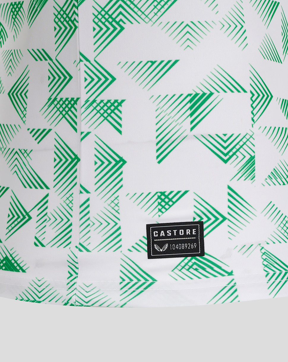 Close up of Mansfield away shirt fabric showing green chevron print and Castore label