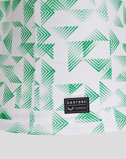 Close up of Mansfield away shirt fabric showing green chevron print and Castore label
